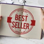 A woman’s hands holding an open book with the words “BEST SELLER” in large red font.